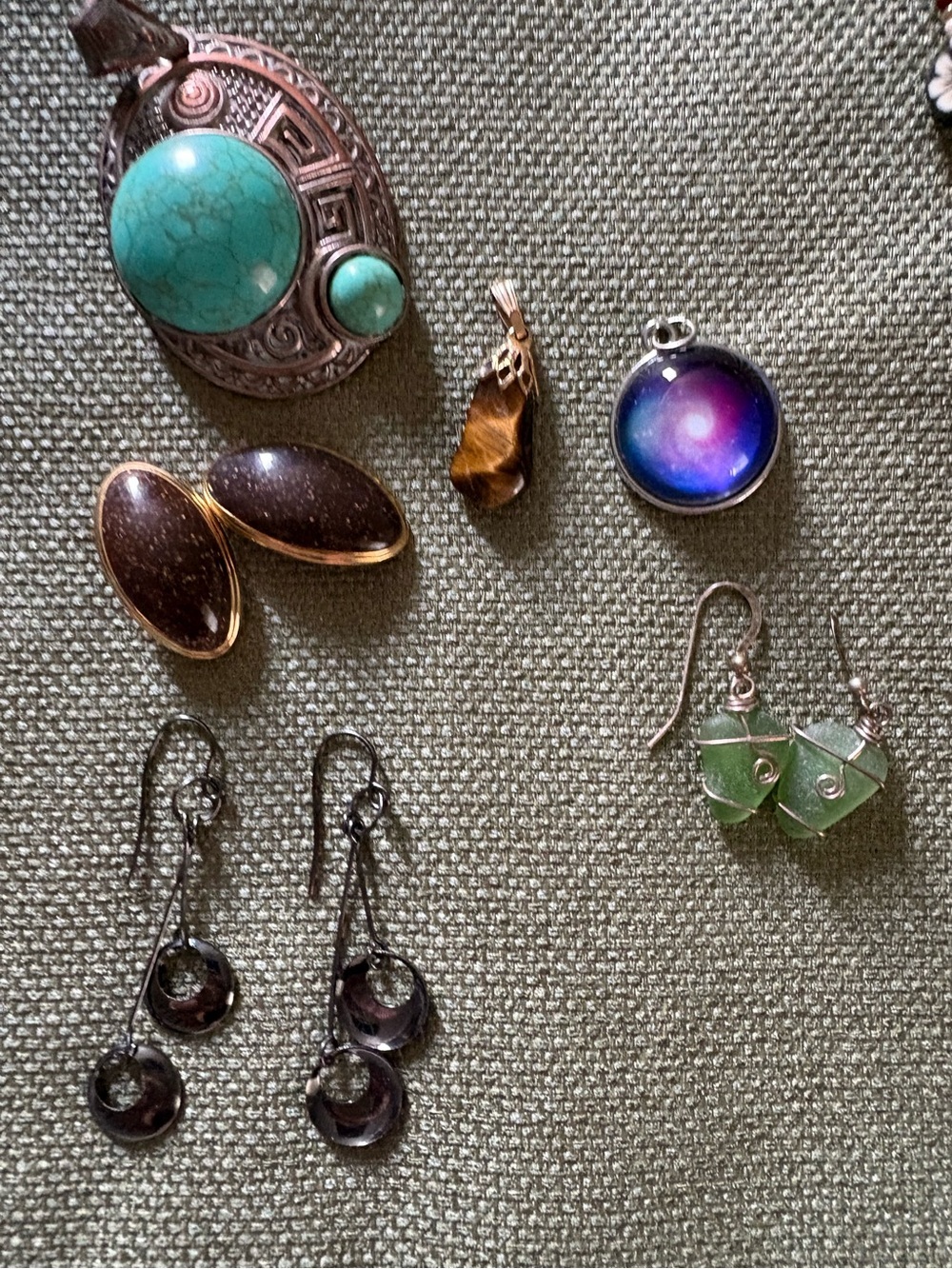 Mix of earrings and necklace pendants